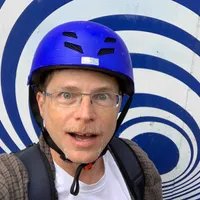 Perrin wearing bicycle helmet